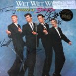 Wet Wet Wet vinyl record bearing signatures.