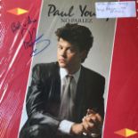 Paul Young vinyl records bearing signatures. (3)