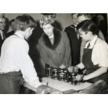 Queen Elizabeth vintage press photograph in a stylish hat, visiting a school, around the late 1960s.