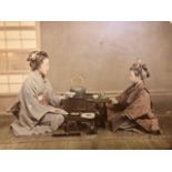 Japanese coloured photographs mounted on both sides of a card. Tea ceremony and a music recital.