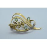 YELLOW GOLD BROOCH SET WITH EMERALDS & DIAMONDS - TESTED AS AT LEAST 9ct GOLD