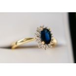 BLUE SAPPHIRE & DIAMOND RING - YELLOW GOLD BAND (HALLMARKS: '375' & 'DIA' / RING SIZE: K)