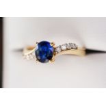 18K GOLD - 0.91 TCW DIAMOND & OVAL SAPPHIRE RING