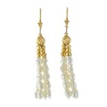 Pair of fresh water pearl earrings In yellow gold 14 Karat. Each earring counts four rows of