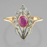 Flower and foliage ring In yellow gold and white gold 14 Karat, set with a cabochon of red stone and