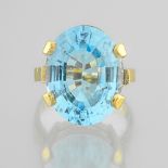 Ring set with an important aquamarine In yellow gold 18 Karat, set with a brilliant oval