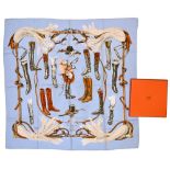 Twill scarf "A propos de bottes" HERMES 90 cm scarf in twill silk, baby blue background and frame,