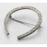 WORK CIRCA 1950 White gold horseshoe brooch In platinum set with forty-four diamonds of various
