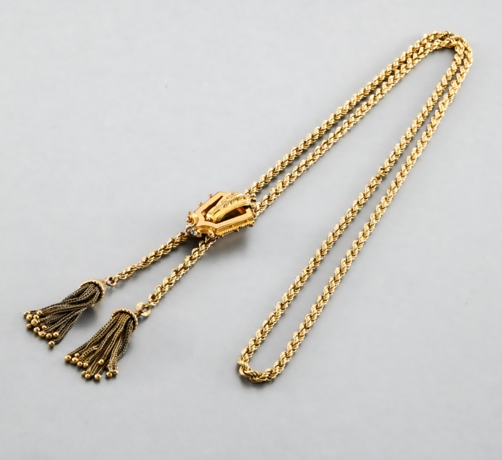 Necklace in yellow gold In yellow 14-carat gold, twisted necklace finished with two pendants. A