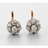 EARLY 20TH CENTURY WORK Diamond daisy earrings In pink 18-carat gold, each earring is set with eight