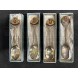OCEAN LINER/CUNARD: Set of four boxed R.M.S. Queen Elizabeth enamelled shipboard souvenir spoons.
