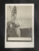 R.M.S. TITANIC: Rare J.W. Barker real photo postcard of a Titanic lifeboat being hoisted aboard