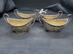 Hallmarked Silver: Set of four oval salts gilt interior, embossed with leaf and scroll decoration