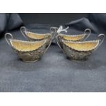 Hallmarked Silver: Set of four oval salts gilt interior, embossed with leaf and scroll decoration