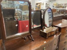 19th cent. Mahogany dressing table mirrors one of oval form over three drawer stand. (3)