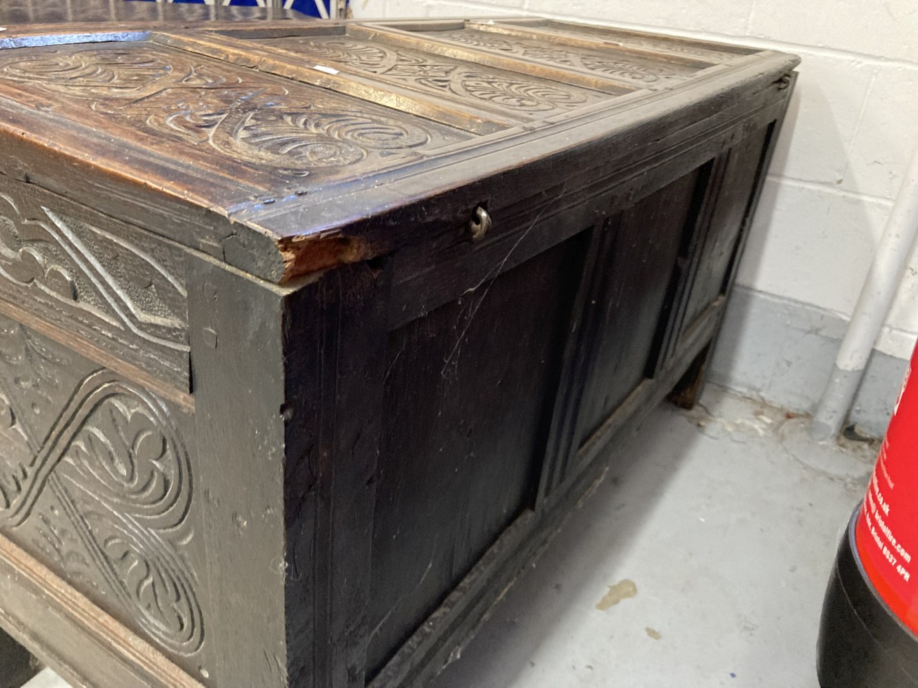 Antique oak coffer with four panelled top and front with carved panels. Carved frieze with date 1692 - Image 5 of 5