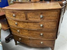 19th cent. Mahogany bow front chest of two over three drawers on splayed supports and lion's head