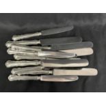 Silver: 800 standard flatware scalloped pattern handles with stainless steel blades, five dinner