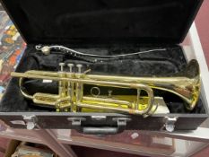 Musical Instruments: Boxed Jupiter trumpet with sheet music.