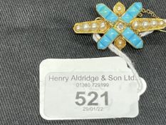 Yellow metal late Victorian bar brooch set with nine half pearls, at the centre is a cross set