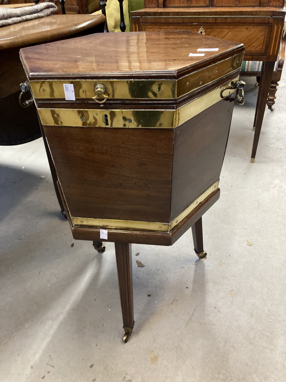 19th cent. Mahogany hexagonal cellaret/wine cooler with brass strapping and side handles on square