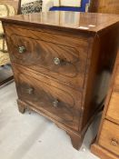 Regency inlaid feathered mahogany commode with lift up top, crossbanded with ebony line, with four