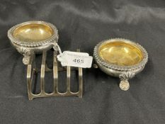 Hallmarked Silver: Pair of salts, gadroon border on three shell hallmarked London, plus a toast rack