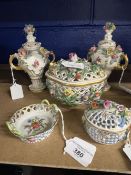 Dresden porcelain to include a pierced basket and lid encrusted with flowers, a smaller lidded and