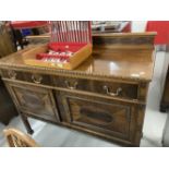 1920s mahogany sideboard two drawers above two cupboards decorated in the Jacobean style with