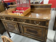 1920s mahogany sideboard two drawers above two cupboards decorated in the Jacobean style with