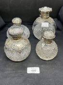 Hallmarked Silver: Perfume bottles cut glass with silver tops hallmarked Birmingham. (4)
