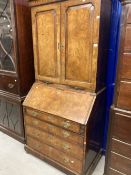 18th cent. Walnut feather banded bureau bookcase with a moulded cornice over two raised and