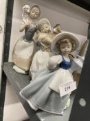 20th cent. Ceramics: Three Nao figurines of girls with an urn and two with sheep.