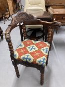 Early 20th cent. Carved oak corner chair with bobbin turned legs, upholstered carpet seat, the