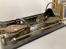 Metalware: Brass and metal fender with coal scuttle, bucket and various tools and bellows.