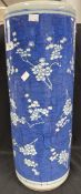 Chinese: Late 19th/early 20th cent. Blue ground Prunus pattern umbrella stand. 24ins.