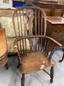 19th cent. Oak and elm comb back carver chair with crinoline stretchers.