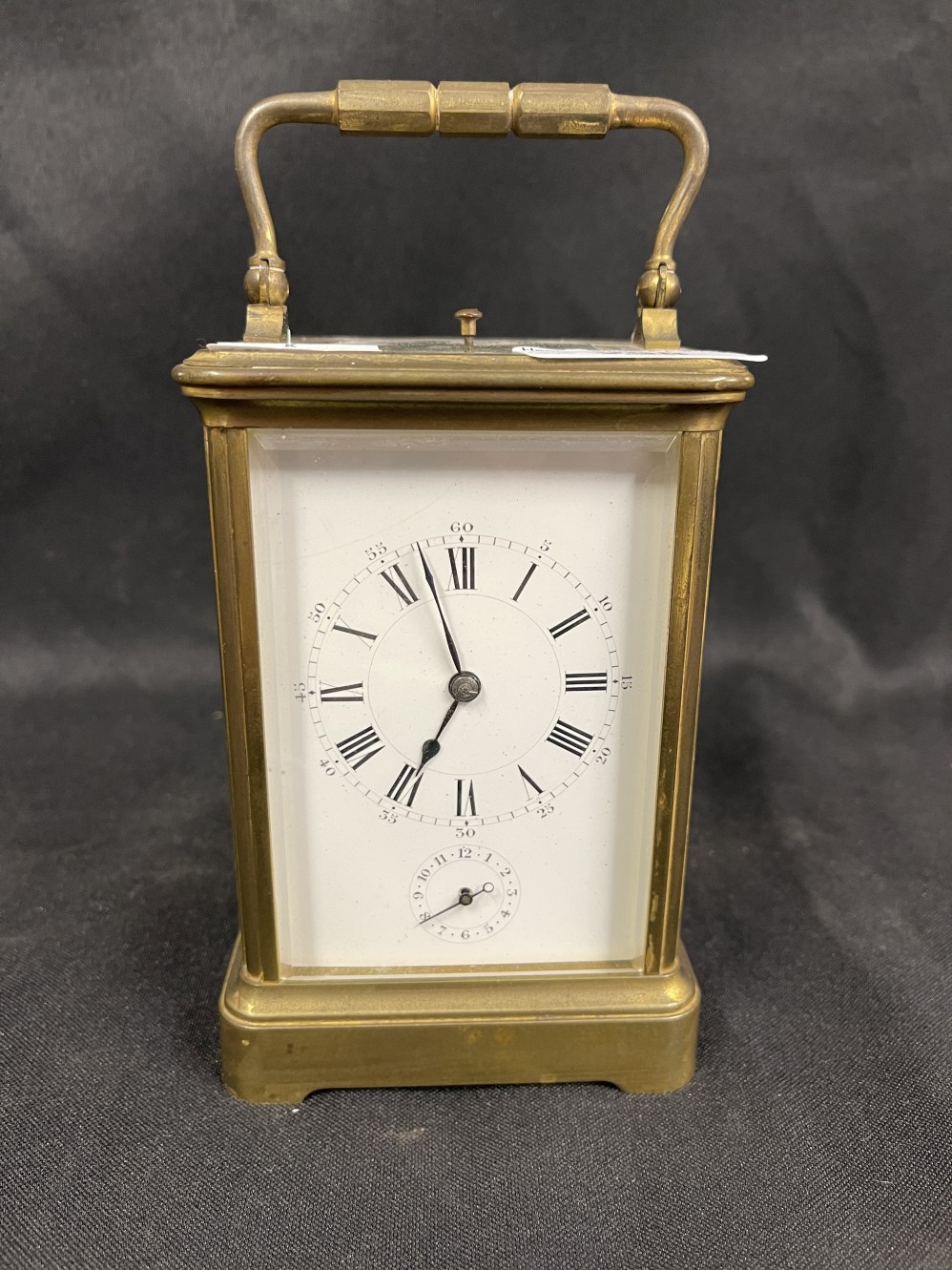 Clocks: 19th cent. French carriage alarm, repeater, striking on the half hours. White enamel dial