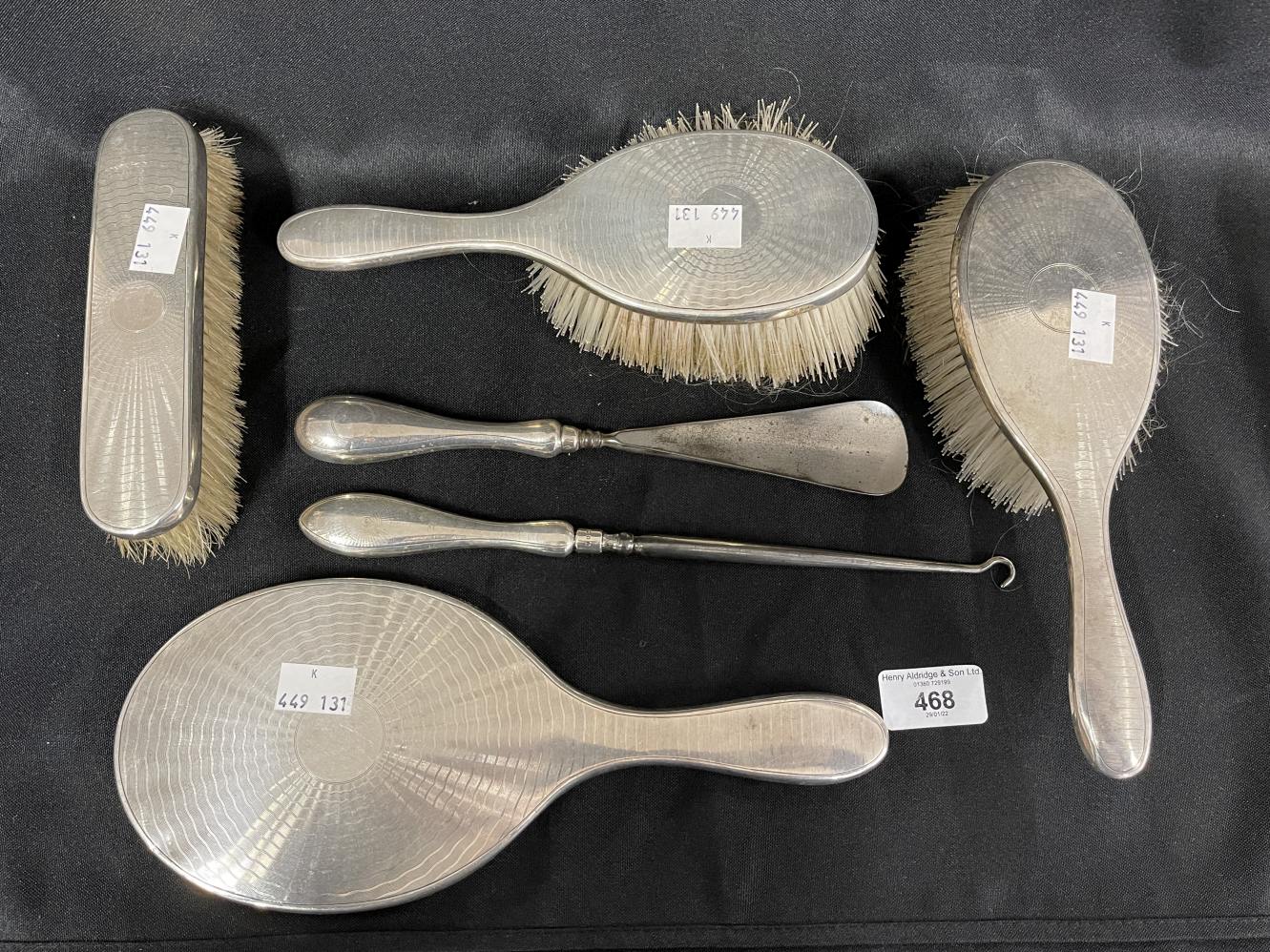 Hallmarked Silver: Dressing table mirror, brushes x 3, button hooks, shoehorn. London marks