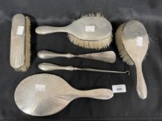 Hallmarked Silver: Dressing table mirror, brushes x 3, button hooks, shoehorn. London marks