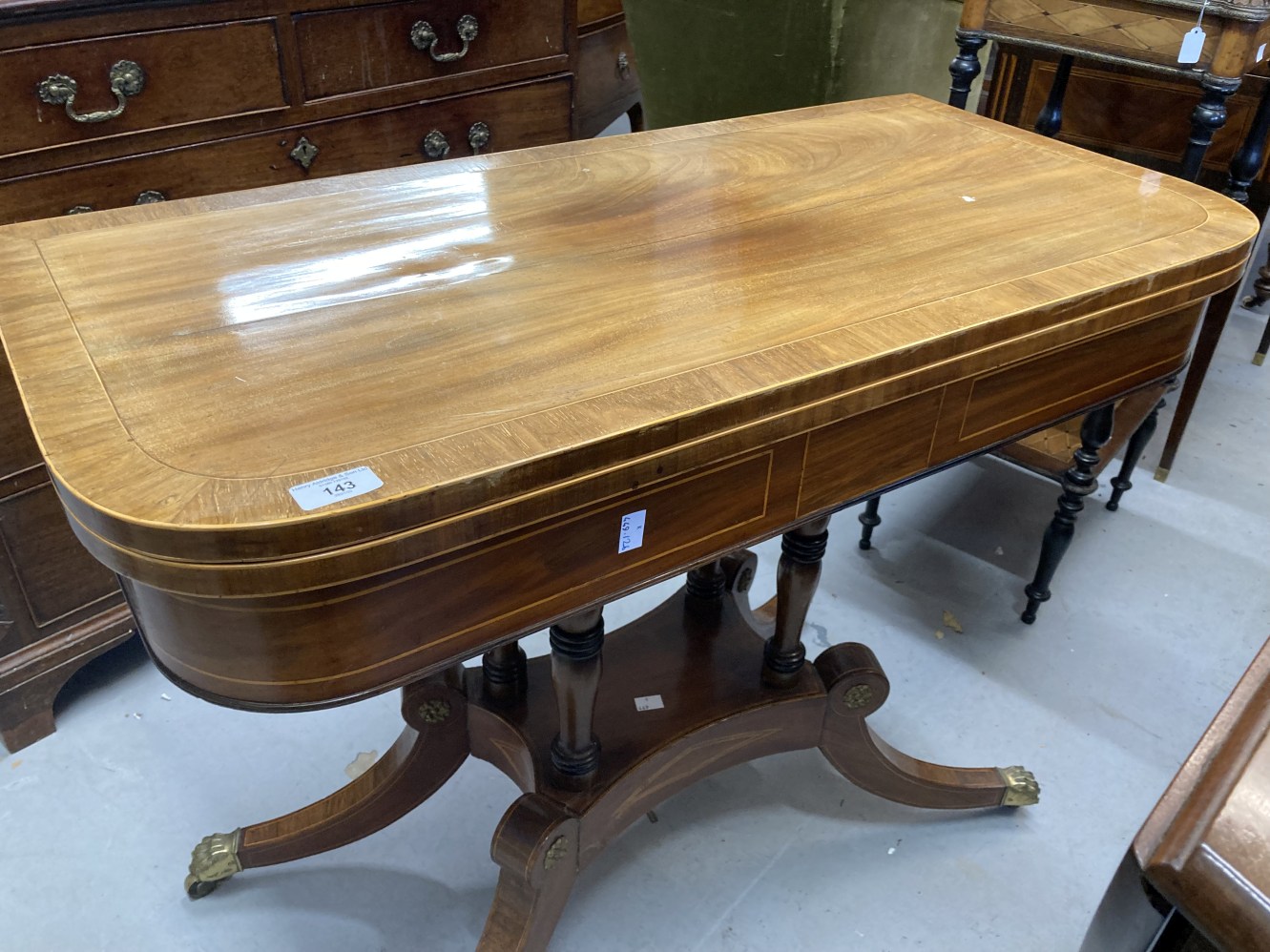 19th cent. Mahogany card table with boxwood inlay on four pillared supports with four splayed feet