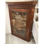 19th cent. Glazed mahogany corner cabinet. 30ins. x 17ins. x 38ins.