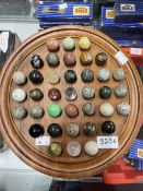 Games & Pastimes: Early 20th cent. Solitaire board and marbles.