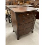 19th cent. Mahogany bow fronted graduated chest of four cockbeaded drawers of small proportions,