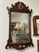 Early 19th cent. Mahogany mirror, shaped top with carved gilded ha ha bird and shaped bottom with