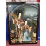 20th cent. Chinese reverse glass painting depicting two elegant ladies in a garden scene, framed.