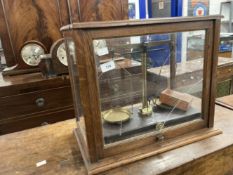 19th cent. Glazed oak cased laboratory scales manufactured by Griffin & Tatlock London Ltd. 18ins. x