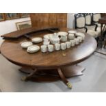 Mid 20th cent. Regency reproduction mahogany Jupp style circular table on four supports, with lion