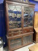 Large mahogany secretaire bookcase, the broken pediment top above a dental cornice above a frieze