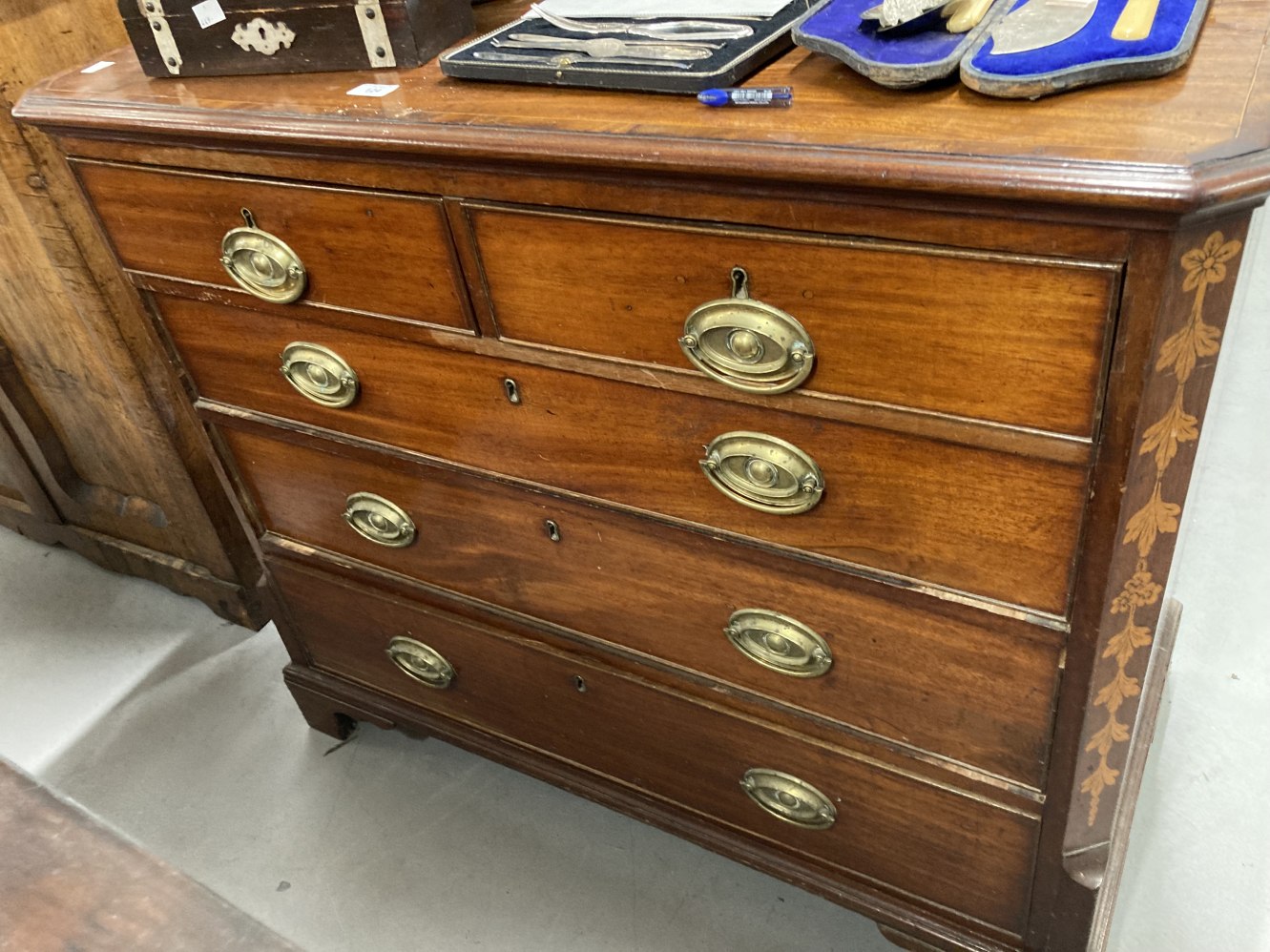 19th cent. Mahogany inlaid straight fronted chest of three long and two short drawers with oval